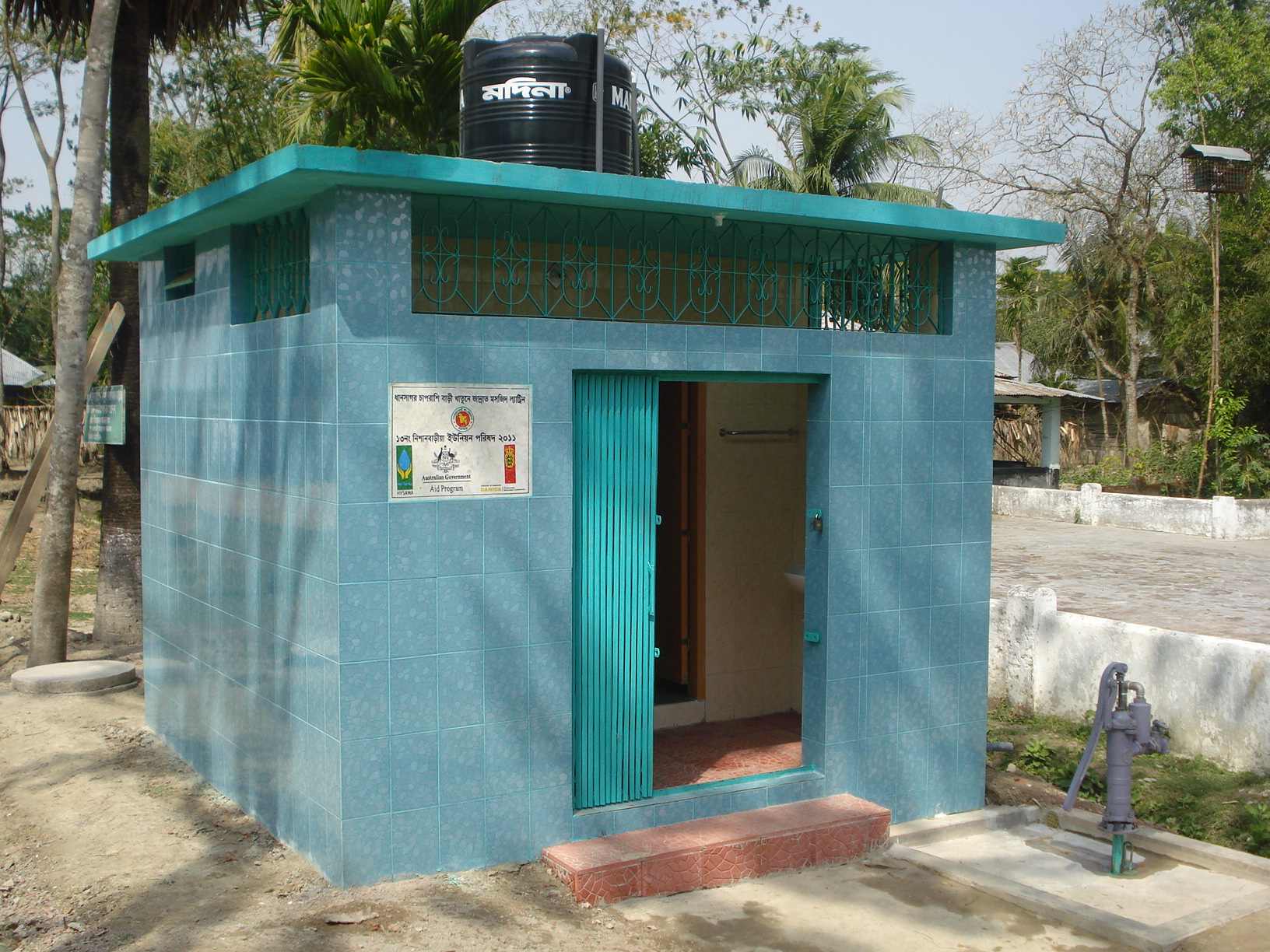 Front view of institutional latrine with pressure pump (Two Chambers)